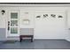 Front entrance showcases brick facade, attached garage, and inviting entry door at 2851 66Th N Way, St Petersburg, FL 33710