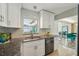 Well-appointed kitchen with granite countertops, stainless steel appliances, and a view to the patio at 2851 66Th N Way, St Petersburg, FL 33710