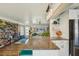 Open-concept kitchen with a granite island, stainless steel appliances, and seamless flow to the living room at 2851 66Th N Way, St Petersburg, FL 33710
