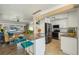Open-concept kitchen with a granite island, stainless steel appliances, and seamless flow to the living room at 2851 66Th N Way, St Petersburg, FL 33710