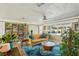 Cozy living space featuring hardwood floors, a comfortable sofa, and bright window views at 2851 66Th N Way, St Petersburg, FL 33710