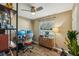Office with a ceiling fan, a desk with multiple monitors, a cabinet with plants and a large window at 2851 66Th N Way, St Petersburg, FL 33710