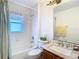 This is a bathroom with a shower and tub, toilet, granite countertops, and natural lighting at 29523 Waggle Dr, San Antonio, FL 33576