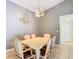 Formal dining room showcasing table, six chairs, and decorative lighting fixture at 29523 Waggle Dr, San Antonio, FL 33576