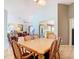 The dining room features a table with six chairs and an open view into living room and kitchen at 29523 Waggle Dr, San Antonio, FL 33576