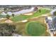 Golf course aerial showcasing manicured putting greens, sand traps, and surrounding water features at 29523 Waggle Dr, San Antonio, FL 33576