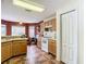 Galley style kitchen with appliances and ample cabinetry at 29523 Waggle Dr, San Antonio, FL 33576