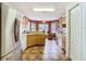 Kitchen showcasing cabinets, counters, appliances, and tile flooring at 29523 Waggle Dr, San Antonio, FL 33576