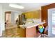 Kitchen features seating area with breakfast bar and views into adjacent living spaces at 29523 Waggle Dr, San Antonio, FL 33576
