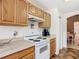 Kitchen highlights counters and cabinets, complemented by a view of the dining area at 29523 Waggle Dr, San Antonio, FL 33576