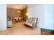 Bright living room with tile floors, comfortable seating, and a dining area in the background at 29523 Waggle Dr, San Antonio, FL 33576