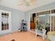 Screened-in patio with sliding glass doors to a large, bright living room with comfortable seats at 29523 Waggle Dr, San Antonio, FL 33576