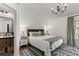 Bright bedroom featuring modern decor, an accent rug, and a modern chandelier at 3314 W Wyoming Cir, Tampa, FL 33611