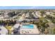 Aerial view of community pool and surrounding neighborhood at 3624 Wiltshire Dr, Holiday, FL 34691