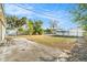 Spacious backyard featuring a concrete patio and partial fence at 3624 Wiltshire Dr, Holiday, FL 34691
