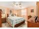 Serene bedroom with wood furnishings, and a large window allowing natural light at 3624 Wiltshire Dr, Holiday, FL 34691