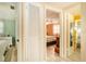 Bright hallway leading to bedrooms and bathroom with wood look tile flooring at 3624 Wiltshire Dr, Holiday, FL 34691