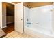 Bathroom featuring a full bathtub with white tiled walls at 3673 Kings Rd # 102, Palm Harbor, FL 34685