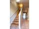 Hallway with wood-look stairs, tile flooring and access to living area at 3673 Kings Rd # 102, Palm Harbor, FL 34685