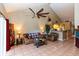 Open-concept living room with high ceilings, tile floors, and view into kitchen at 3673 Kings Rd # 102, Palm Harbor, FL 34685