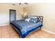 Comfortable main bedroom with neutral walls, tile flooring, and a cozy atmosphere at 3673 Kings Rd # 102, Palm Harbor, FL 34685