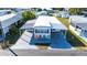 Aerial view of a mobile home with driveway and several colorful chairs at 37150 Sandra Ave, Zephyrhills, FL 33542