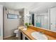 Standard bathroom featuring vanity, mirror, and a view of a shower at 37150 Sandra Ave, Zephyrhills, FL 33542