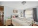 Well-lit bedroom with a charming nightstand and accents at 37150 Sandra Ave, Zephyrhills, FL 33542