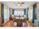 Bright dining area with a glass-top table, wicker chairs, and plenty of natural light at 37150 Sandra Ave, Zephyrhills, FL 33542