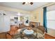 Cozy dining area adjacent to the kitchen, with a glass table and seating for four at 37150 Sandra Ave, Zephyrhills, FL 33542