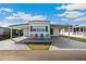 Charming single-story home with a covered carport and cozy outdoor seating area at 37150 Sandra Ave, Zephyrhills, FL 33542