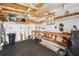 Spacious garage with peg board walls, a workbench, and ample storage at 37150 Sandra Ave, Zephyrhills, FL 33542