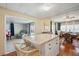 Open concept kitchen with an island that flows into the dining and living areas at 37150 Sandra Ave, Zephyrhills, FL 33542