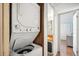 A convenient, stackable laundry center leading to the bathroom at 37150 Sandra Ave, Zephyrhills, FL 33542