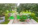 Aerial view of the miniature golf course with green fairways and playful decorations at 37150 Sandra Ave, Zephyrhills, FL 33542