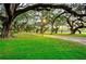 Scenic park view with mature trees, walking paths, and benches, perfect for relaxation and recreation at 37150 Sandra Ave, Zephyrhills, FL 33542