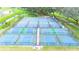 Well-maintained tennis and pickleball courts offer a vibrant recreational amenity in a lush, green community setting at 37150 Sandra Ave, Zephyrhills, FL 33542