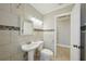 Fully tiled bathroom includes a vanity, toilet, and shower/tub combo for a functional design at 4101 W Leila Ave, Tampa, FL 33616