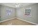 Bedroom with tile flooring, neutral walls, ceiling fan, and bright windows at 4101 W Leila Ave, Tampa, FL 33616