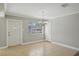 Bright dining room with neutral tones, tile floors, and a modern chandelier at 4101 W Leila Ave, Tampa, FL 33616