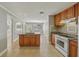 Kitchen featuring tile flooring, an island with a sink, and an open layout at 4101 W Leila Ave, Tampa, FL 33616