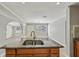 Spacious kitchen with granite counters, modern faucet, and double stainless steel sink at 4101 W Leila Ave, Tampa, FL 33616