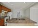 Open kitchen with granite counters, stainless steel sink, tile floor, and modern appliances at 4101 W Leila Ave, Tampa, FL 33616