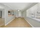 Bright living room with tile flooring, ceiling fan, and large windows at 4101 W Leila Ave, Tampa, FL 33616