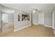 Open-concept living room with tile flooring and access to kitchen and other rooms at 4101 W Leila Ave, Tampa, FL 33616