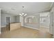 Open living space with tile flooring, archways, and views into the kitchen and dining areas at 4101 W Leila Ave, Tampa, FL 33616