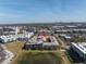 Overhead shot showcases the property with a pond, surrounding buildings, and city views in the distance at 4221 W Spruce St # 1325, Tampa, FL 33607