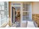 Relaxing balcony with wicker chairs overlooks the interior of the unit at 4221 W Spruce St # 1325, Tampa, FL 33607