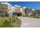 Exterior view of building featuring lush landscaping and a covered entrance at 4221 W Spruce St # 1325, Tampa, FL 33607