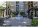 Courtyard featuring a beautiful fountain, benches, and manicured landscaping at 4221 W Spruce St # 1325, Tampa, FL 33607